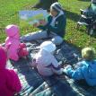 Playgroup story time with Ms. Fran on Friday. At a park.